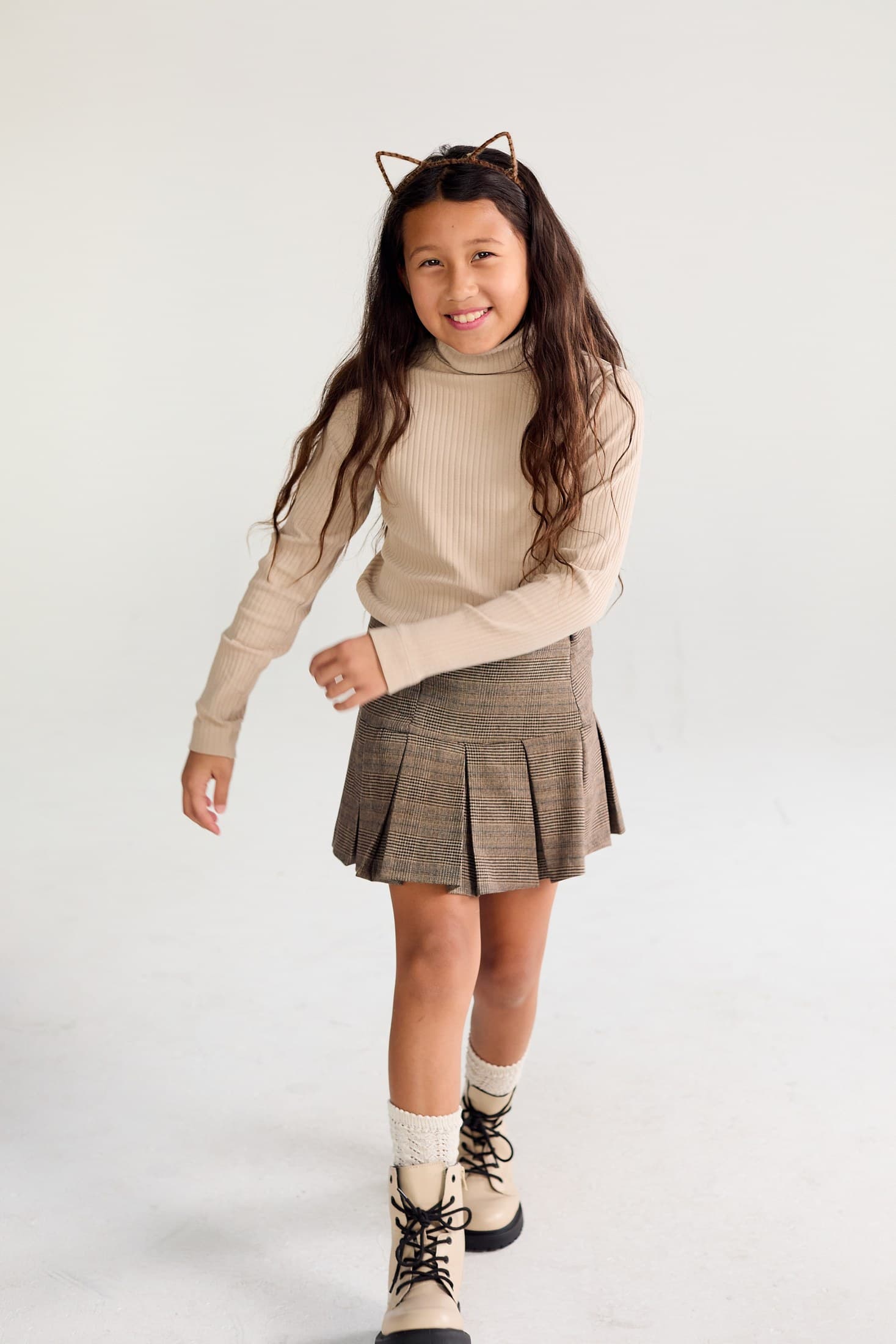 Kylie Akimoto in a cream studio fashion portrait